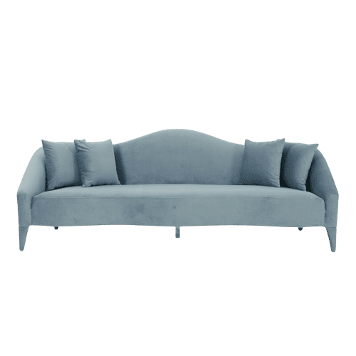 A blue velvet sofa on a white background.