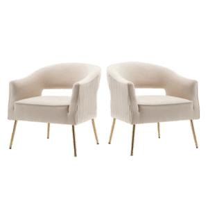 A pair of beige velvet chairs with gold legs.