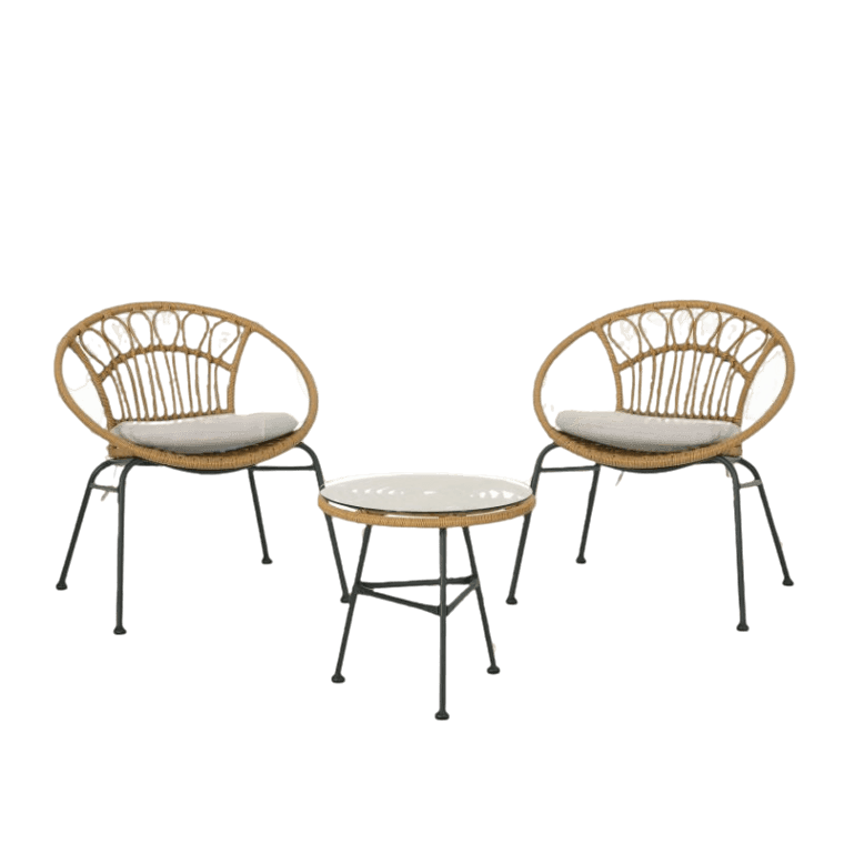 A set of two rattan chairs and a coffee table.