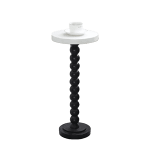 A black and white candle stand with a white top.