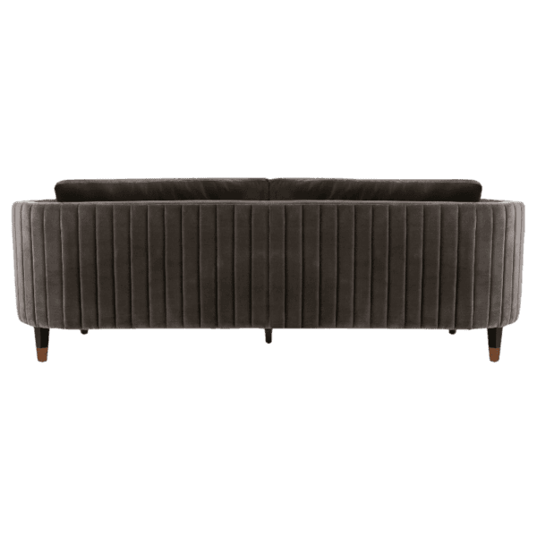 A grey velvet sofa with wooden legs on a white background.