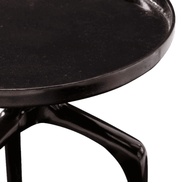 A black side table with metal legs and a round top.