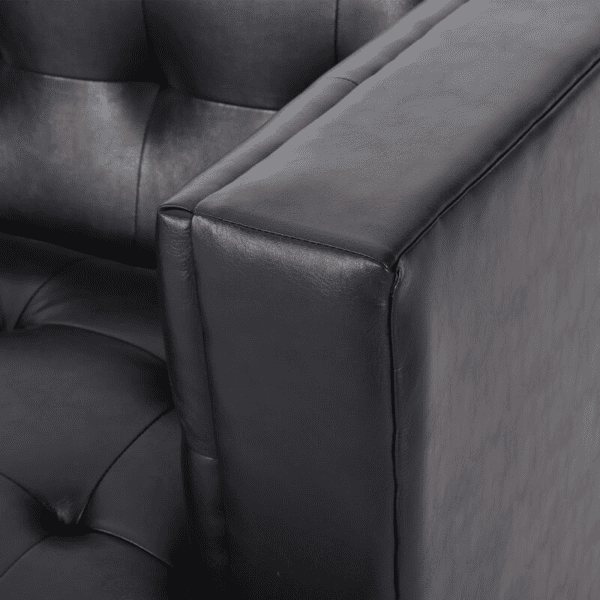 A close up view of a black leather chair.