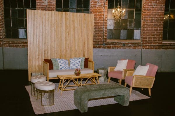 Chic lounge area with a mix of modern and rustic elements featuring Slat Walls in an industrial space.